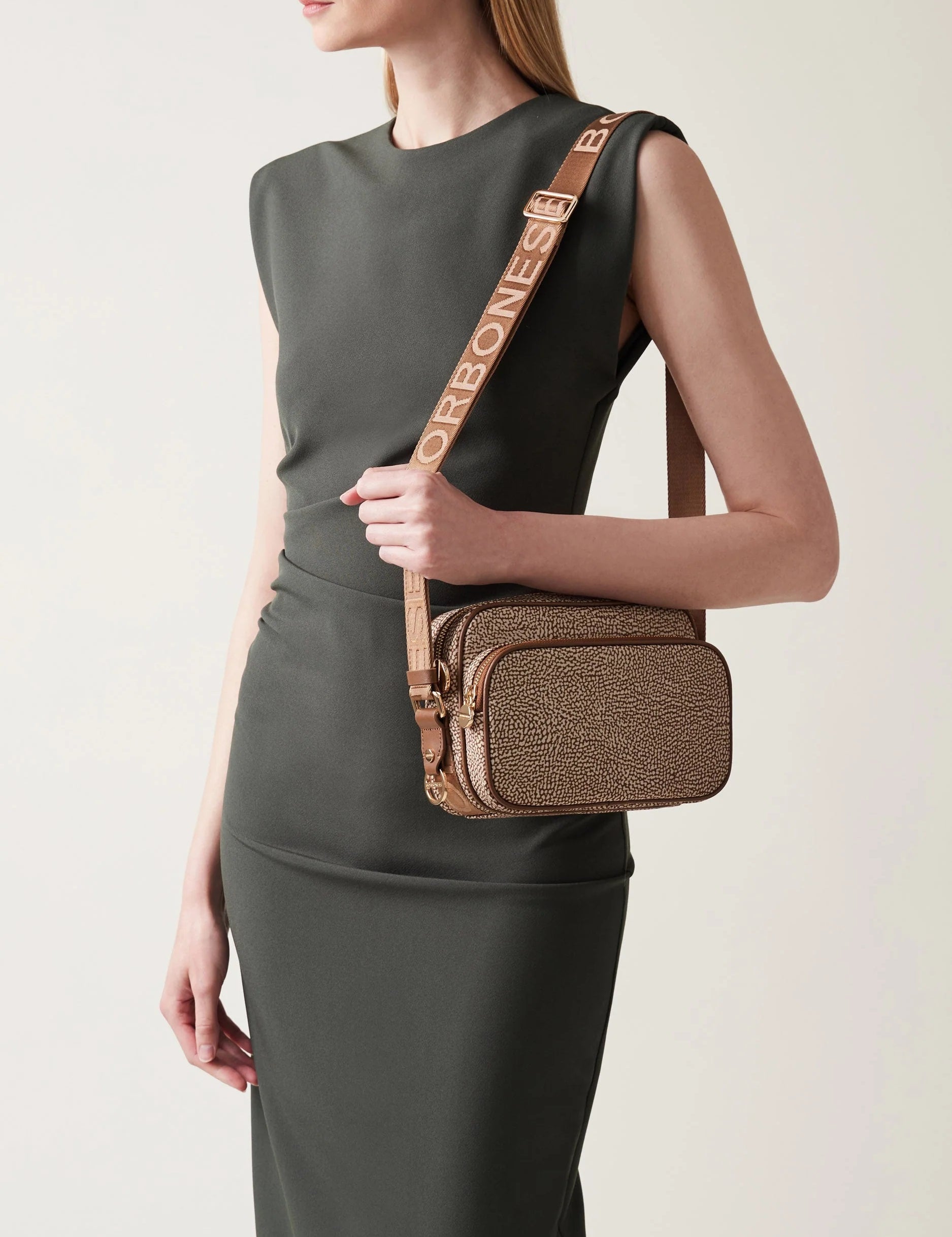 Small Borbonese Eco Line camera case with shoulder strap, compact and stylish accessory for daily use.