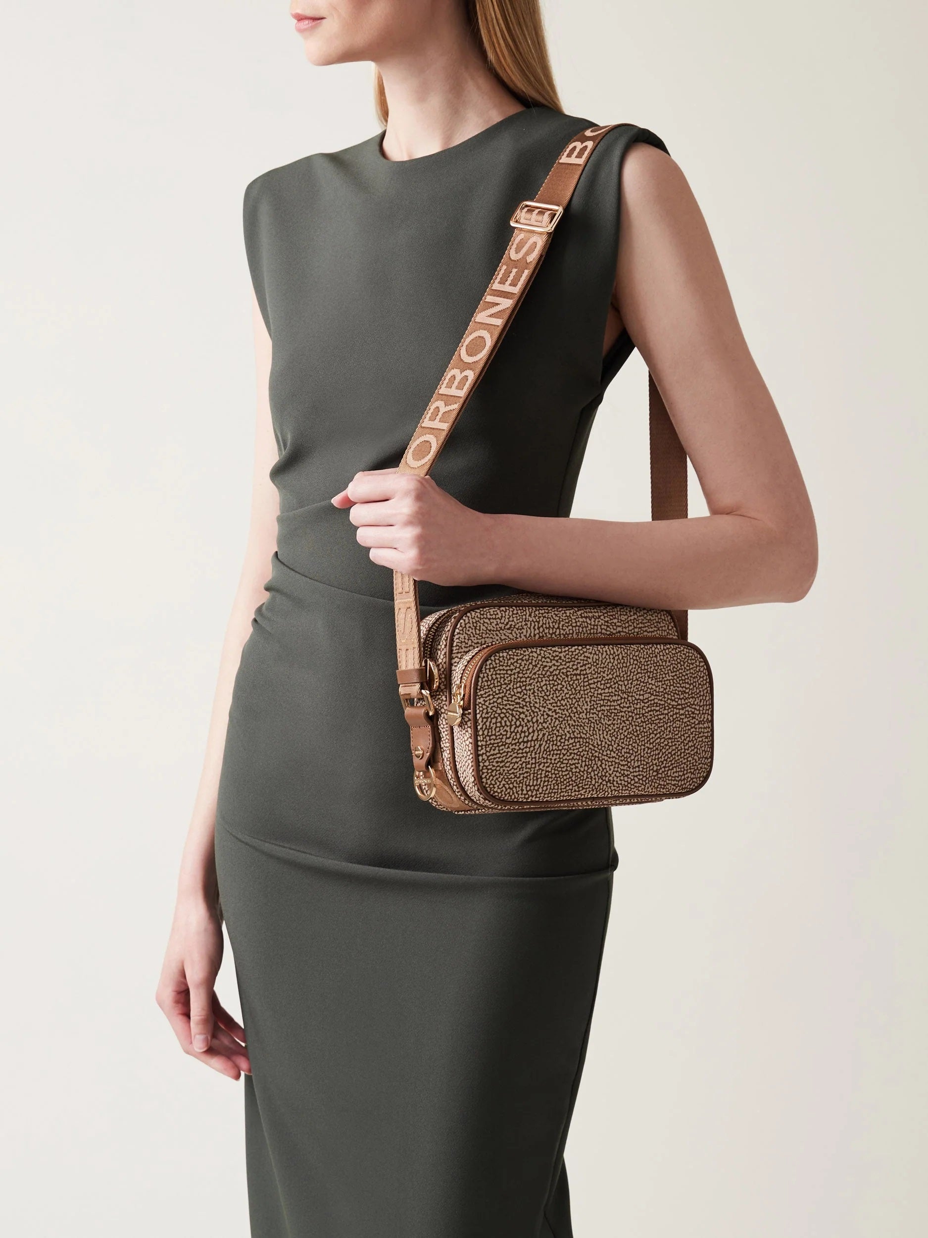Small Borbonese Eco Line camera case with shoulder strap, compact and stylish accessory for daily use.
