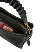 Small Coccinelle Boheme shoulder bag in beige with gold chain strap, stylish accessory for women.