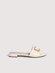 Coccinelle C-Me women's sandal with tan leather straps and open toe, showcasing stylish summer footwear.