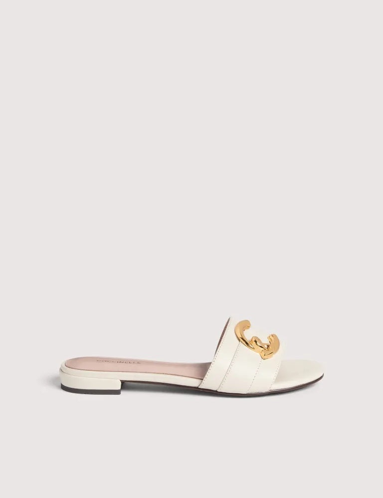 Coccinelle C-Me women's sandal with tan leather straps and open toe, showcasing stylish summer footwear.