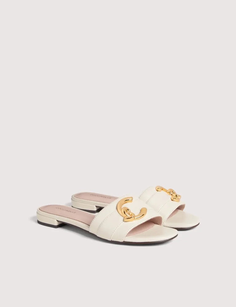 Coccinelle women's C-Me sandal with open toe and ankle strap, featuring nude-colored leather and stylish design.