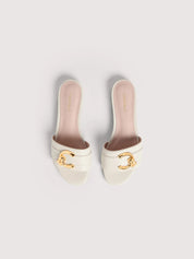 Coccinelle women's sandal with strappy design and block heel, stylish beige leather footwear for warm weather.
