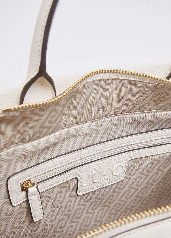 Liu Jo Ridhi women's hand bag in beige with gold hardware, featuring a structured design and top handle for elegant style.