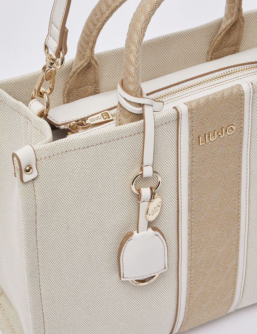 Liu Jo women's hand bag, stylish black leather tote with gold-tone hardware, suitable for casual and formal occasions.