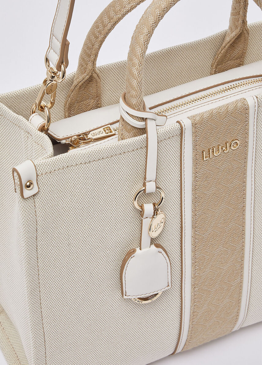Liu Jo women's hand bag, stylish black leather tote with gold-tone hardware, suitable for casual and formal occasions.