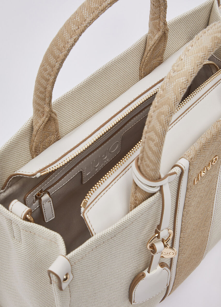 Liu Jo women's handbag, stylish black leather purse with gold hardware, featuring a top handle and minimalist design.