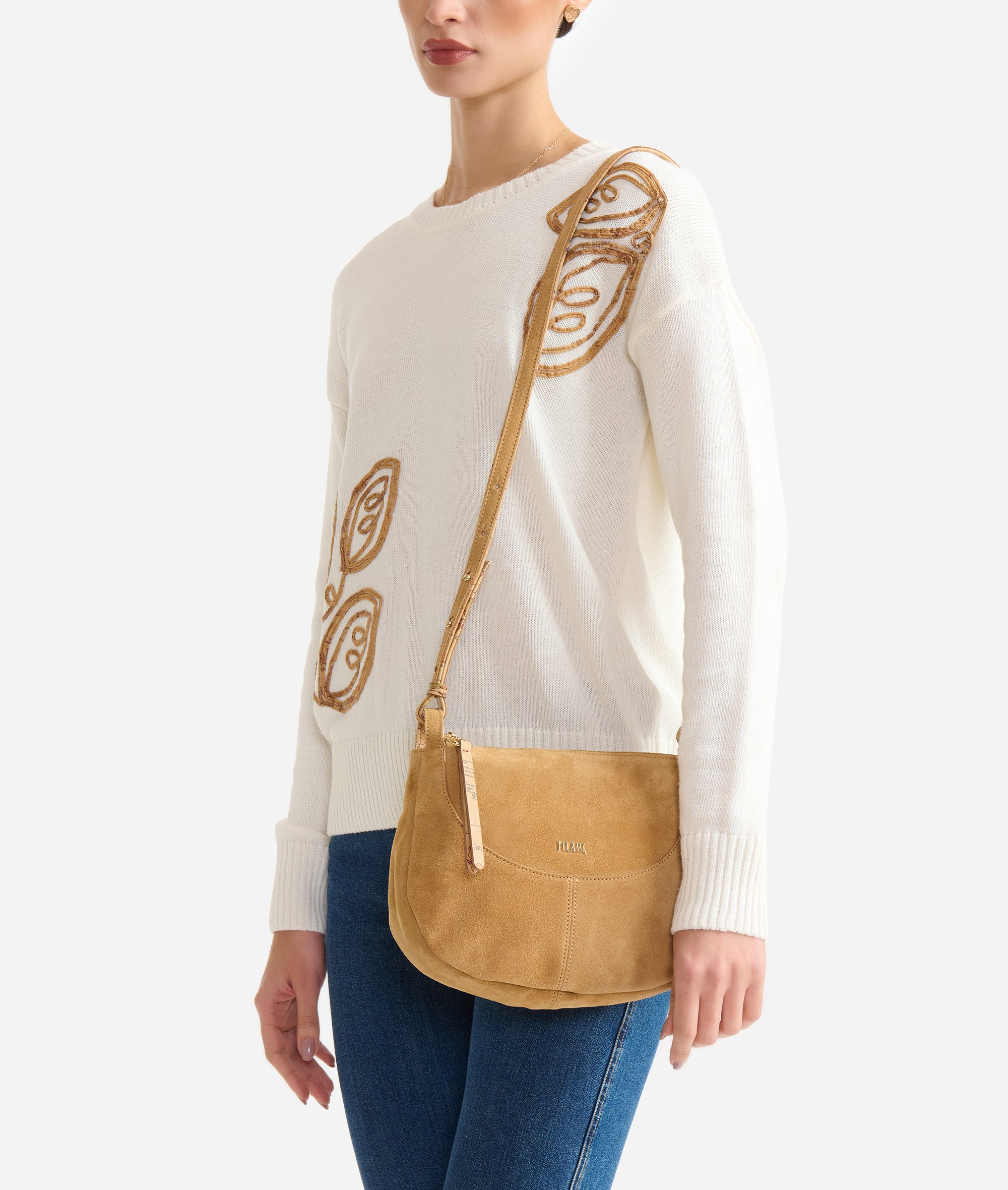 Alviero Martini 1ª Classe tribal-style mini crossbody bag for women with unique pattern and adjustable strap.
