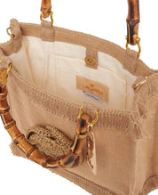 Medium pink LaMilanesa women's handbag with top handle, stylish accessory for everyday wear.