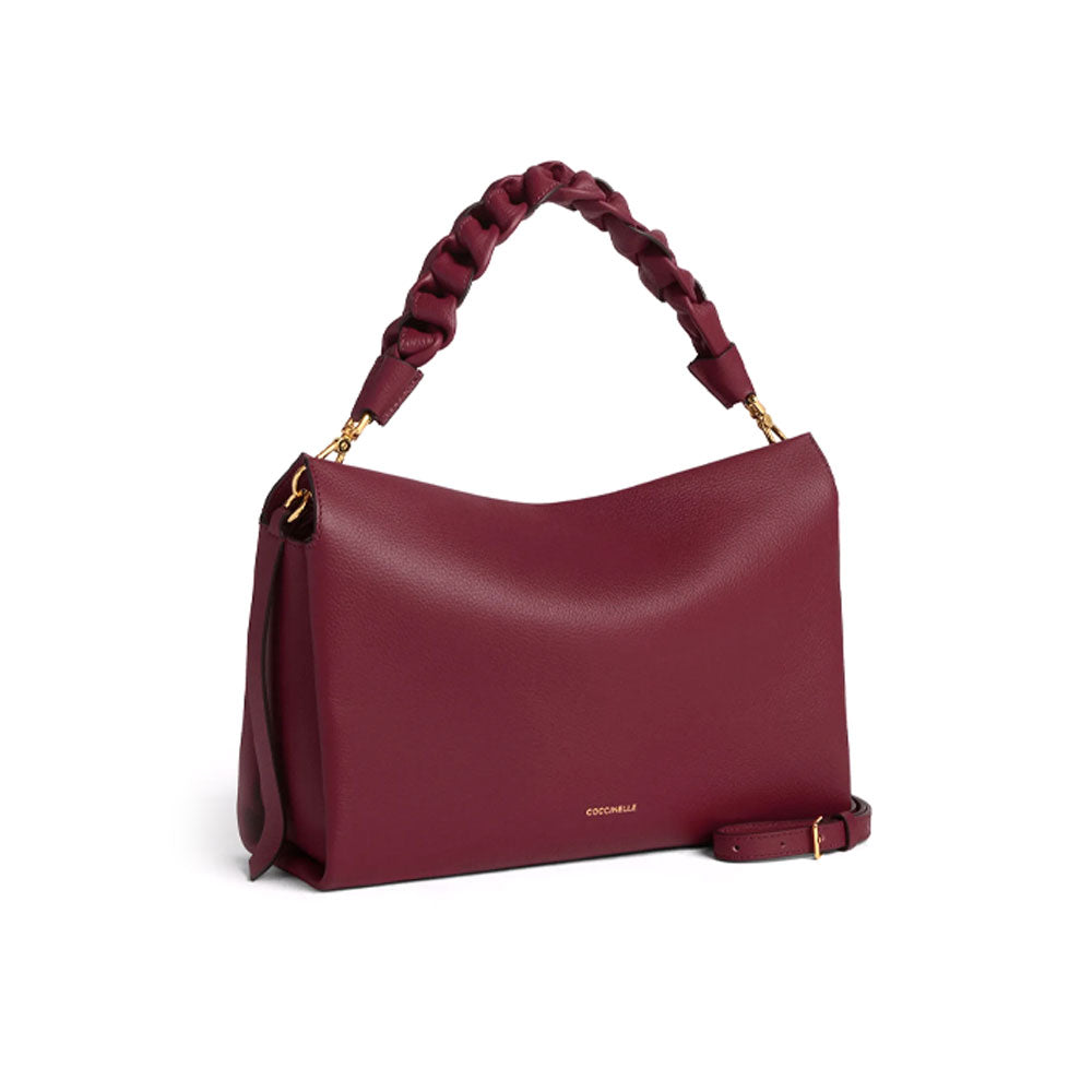 Medium Coccinelle Boheme leather shoulder bag for women, stylish accessory with a smooth texture and adjustable strap.