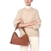 Medium Boheme shoulder bag by Coccinelle in stylish leather, featuring a structured design and elegant craftsmanship.