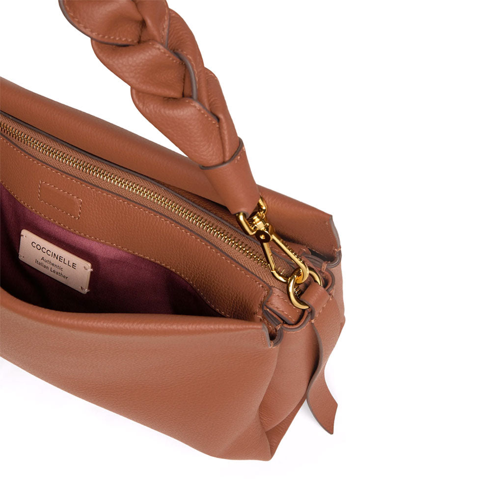 Medium Coccinelle bohemian leather shoulder bag with adjustable strap and subtle stitching details.