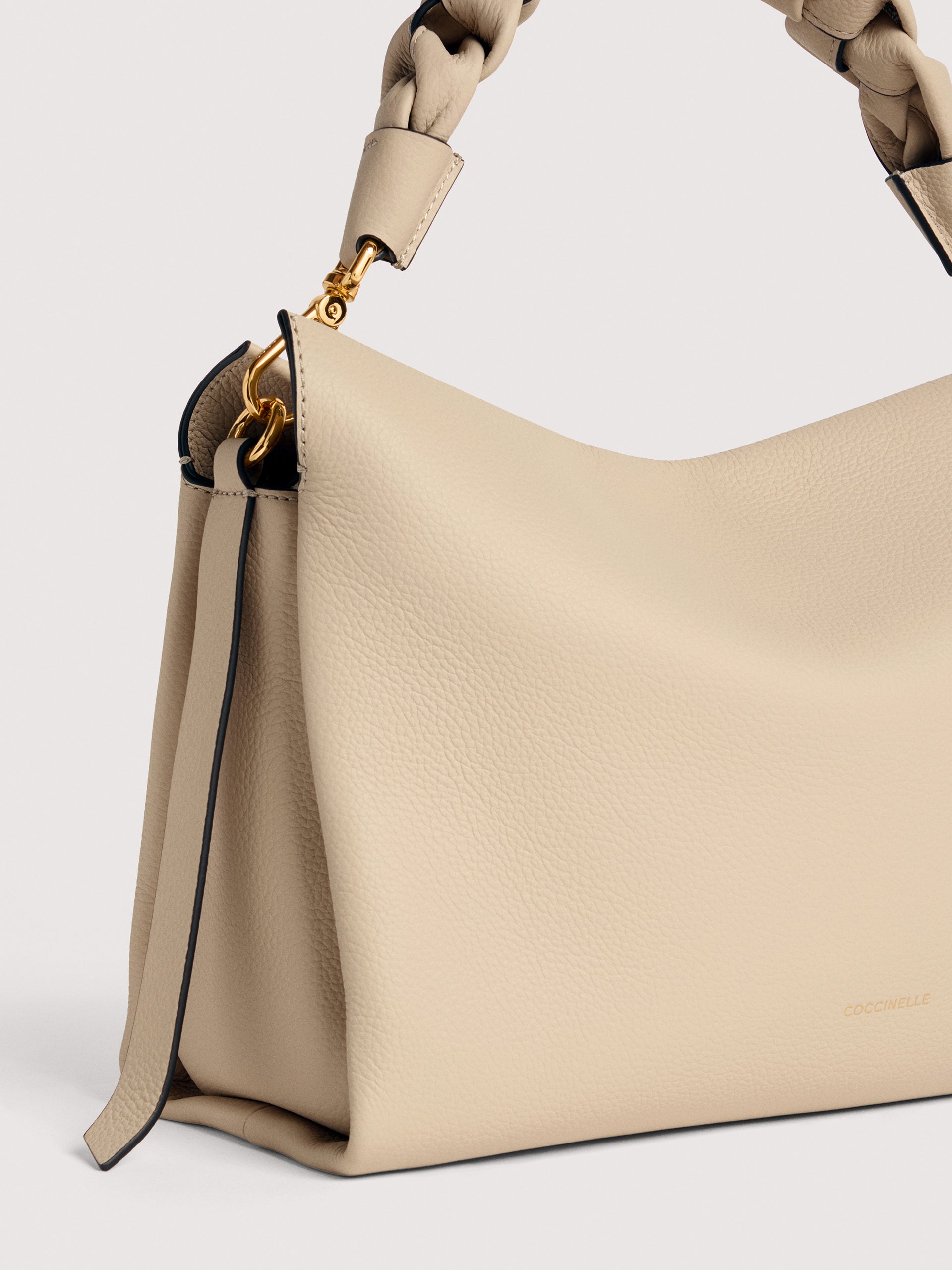 Medium Boheme shoulder bag by Coccinelle in stylish leather, featuring a sleek design and versatile carrying options.