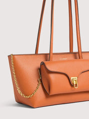 Coccinelle Double Beat shoulder bag for women, stylish black leather shopping bag with silver hardware.