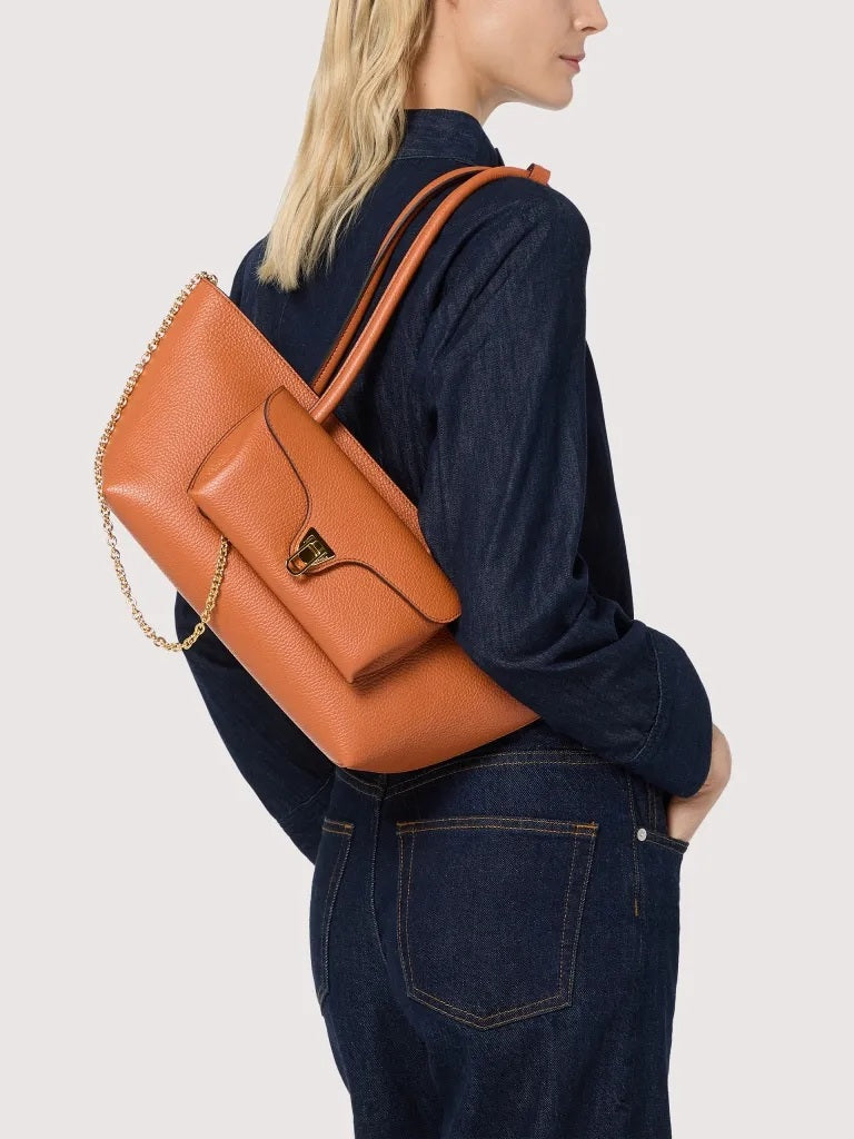 Coccinelle Double Beat shoulder bag in black leather with double handles, stylish accessory for women.