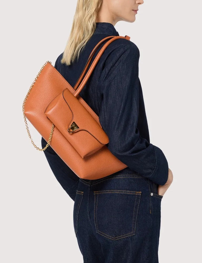 Coccinelle Double Beat shoulder bag in black leather with double handles, stylish accessory for women.