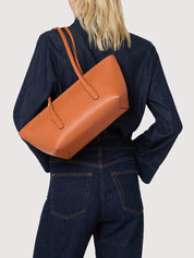 Coccinelle Double Beat shoulder bag in stylish black, crafted for women, featuring a sleek design and spacious interior.