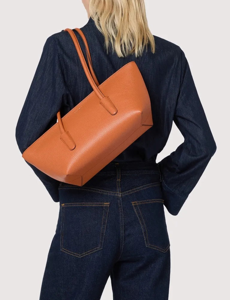 Coccinelle Double Beat shoulder bag in stylish black, crafted for women, featuring a sleek design and spacious interior.