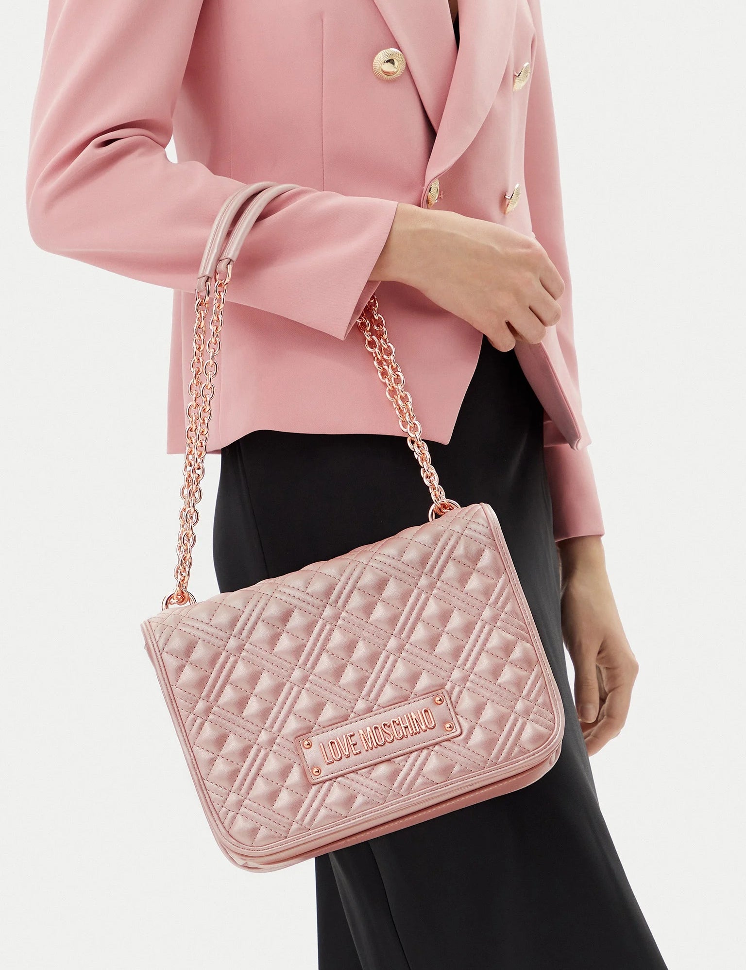 Love Moschino quilted shoulder bag for women, stylish accessory with a padded, textured design and silver chain strap.