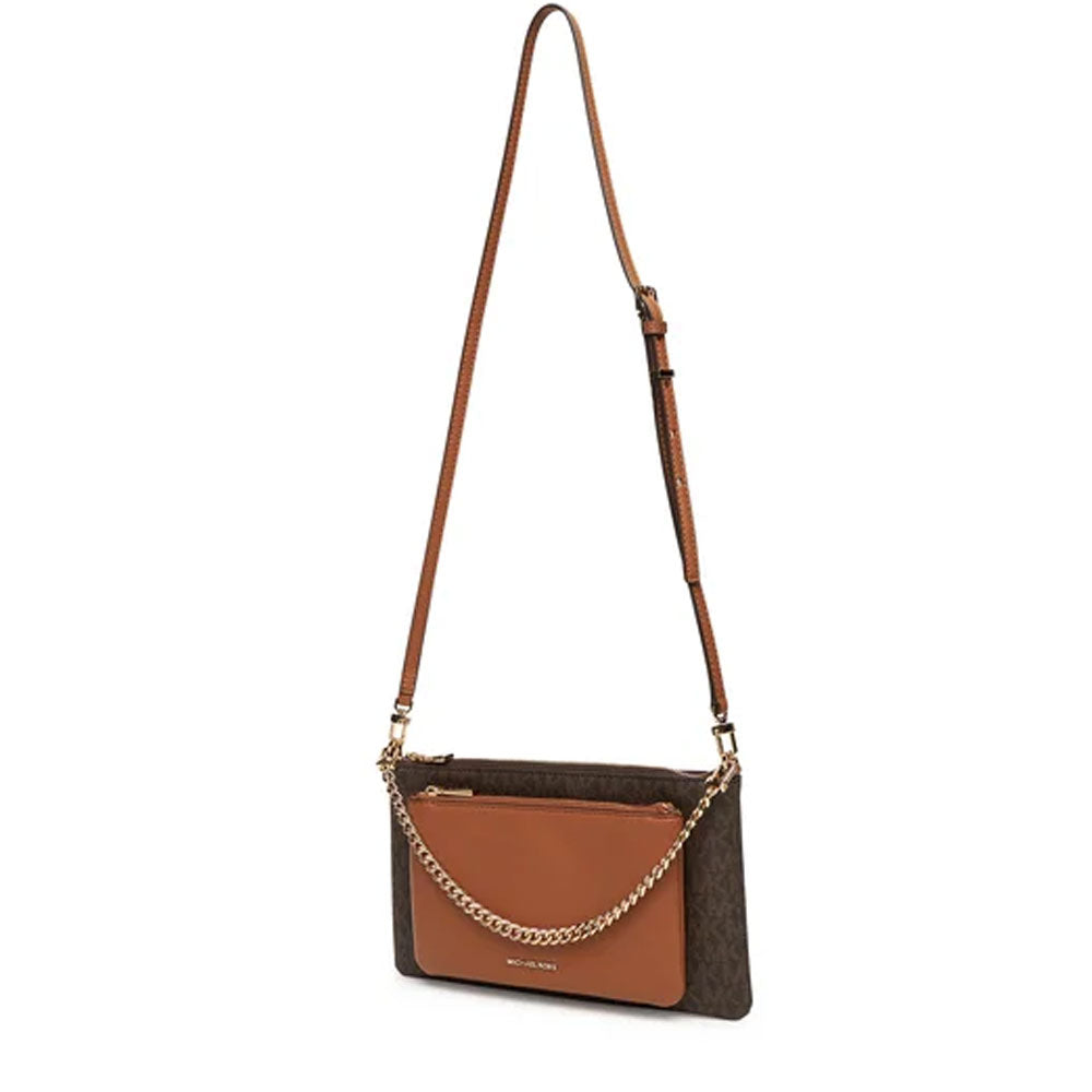 Medium Jet Set Michael Kors handbag in beige with gold-tone hardware, featuring a structured shape and top handles.
