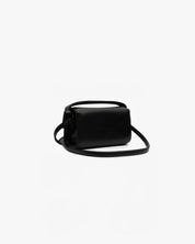 Borsa in pelle vegana nera, modello The Cuti Baby OG Mabash, con manico e tracolla staccabile, vista di lato su sfondo bianco.