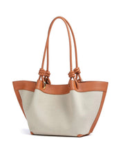 Medium Coccinelle Finn shopper bag in black leather with sturdy handles and spacious interior for everyday shopping and accessories.