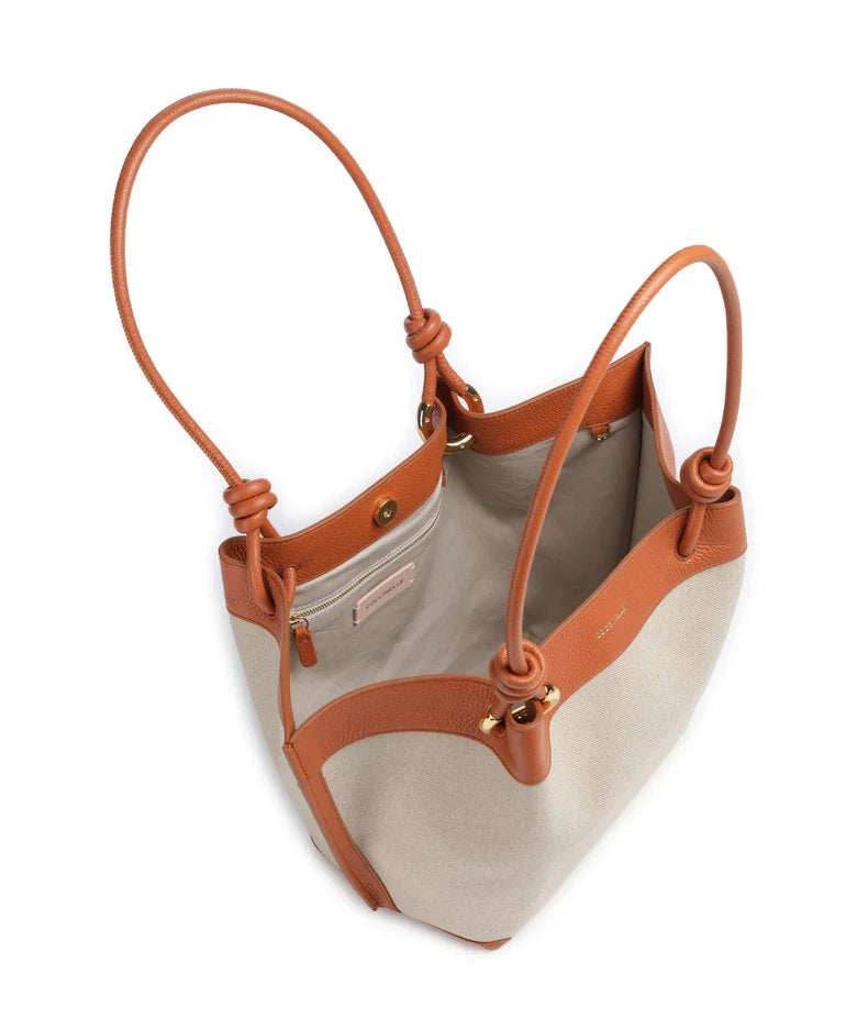 Coccinelle Finn Medium Shopper Bag for women, stylish leather tote with handles, in a medium size with sleek design.