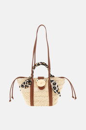 Borsa Soleil Basket di Rue Madam, borsa a spalla in tessuto con design intrecciato e manici lunghi.