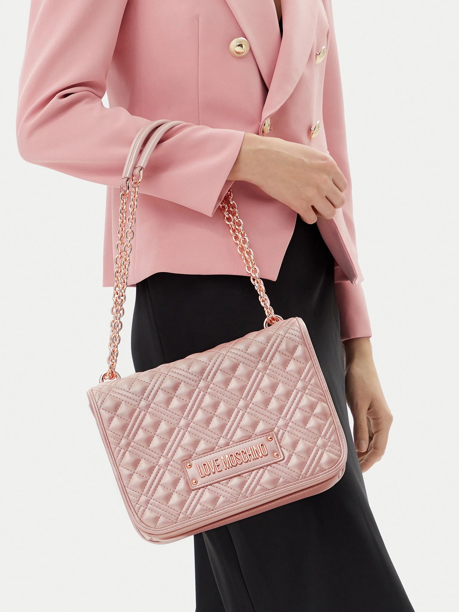 Love Moschino quilted shoulder bag for women, stylish accessory with a padded, textured design and silver chain strap.