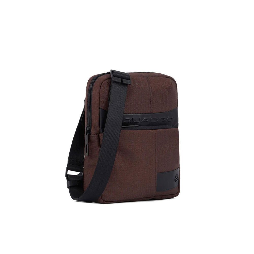 Piquadro men's iPad mini pouch in black leather with adjustable shoulder strap, compact and stylish accessory.