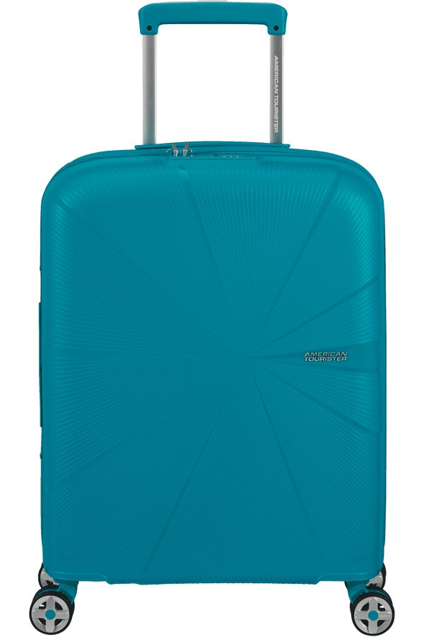 Expandable American Tourister Starvibe cabin trolley suitcase with four wheels and a retractable handle for travel.