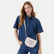 Mini Guess Calebra crossbody bag in black with a stylish design and adjustable strap, perfect for everyday use.