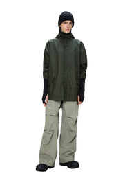 Unisex Rains fishtail jacket in waterproof fabric, featuring a sleek trench design with a hood and adjustable waist.