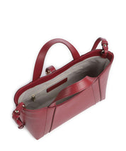Furla Goccia S tote bag with fur accents, stylish leather handbag for women, featuring a sleek design and top handles.