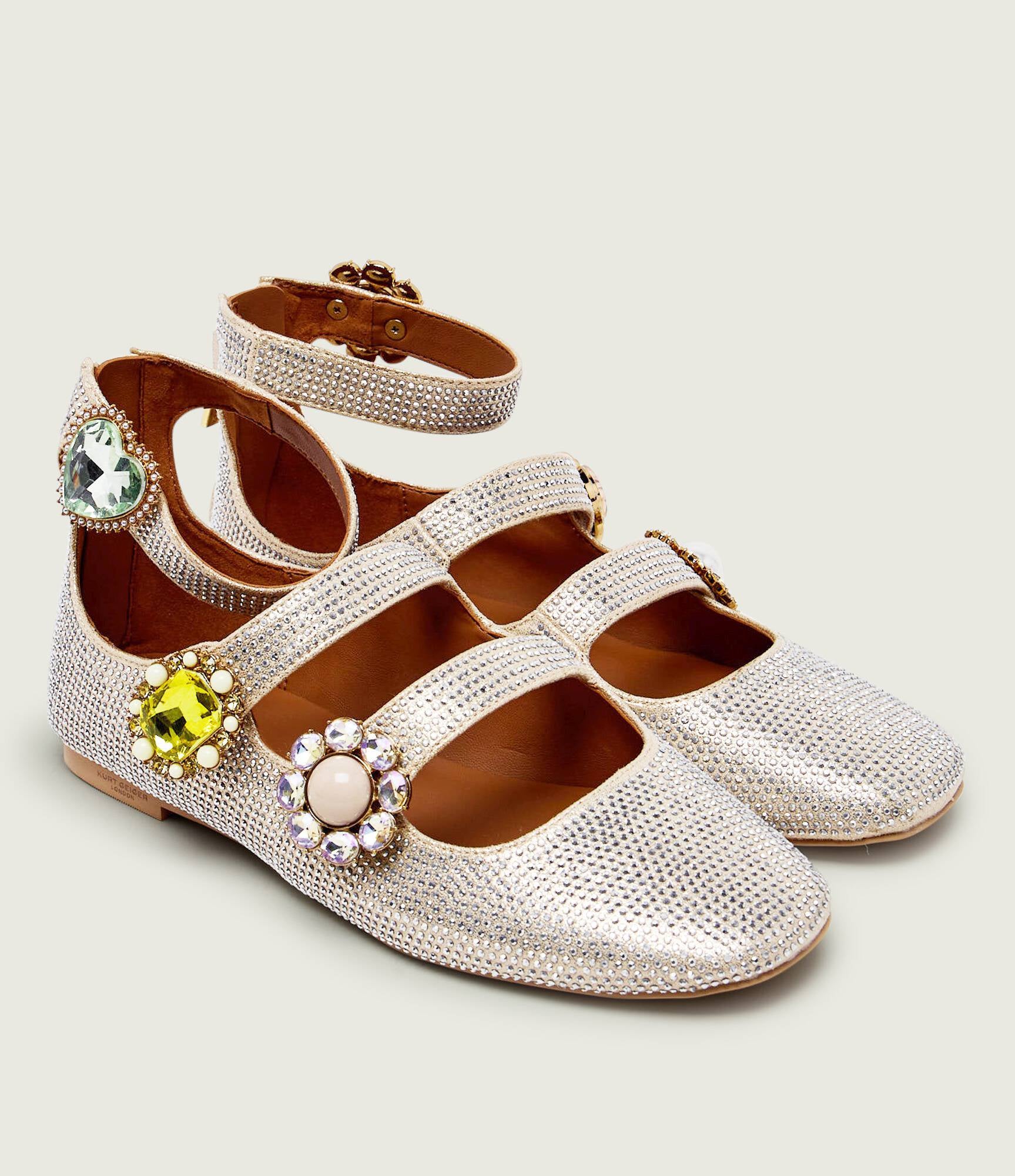 Ornate gladiator ballet flats by Kurt Geiger featuring intricate strap detailing and a stylish, feminine design for women.