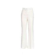 Light blue Vicolo women's flared pants with a relaxed fit and high waist, shown on a model in a casual setting.