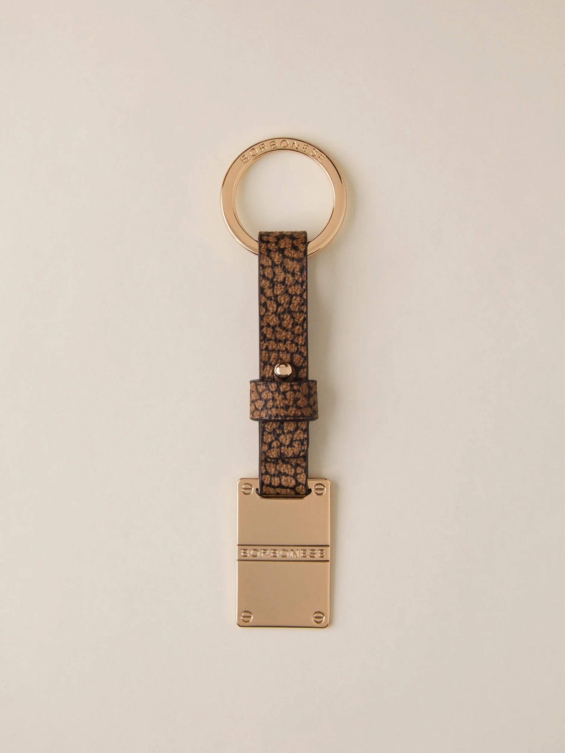 Borbonese keychain with metal piastrina design, stylish accessory for women featuring the brand's signature details.