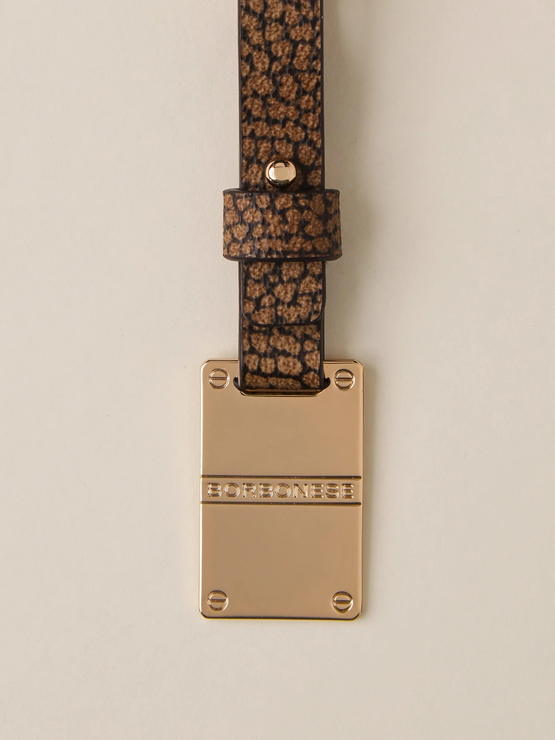 Borbonese keychain with a decorative piastrina metal charm, stylish accessory for women’s handbag or keys.