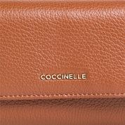 Coccinelle metallic soft leather women's wallet with a sleek, shiny finish and compact design.