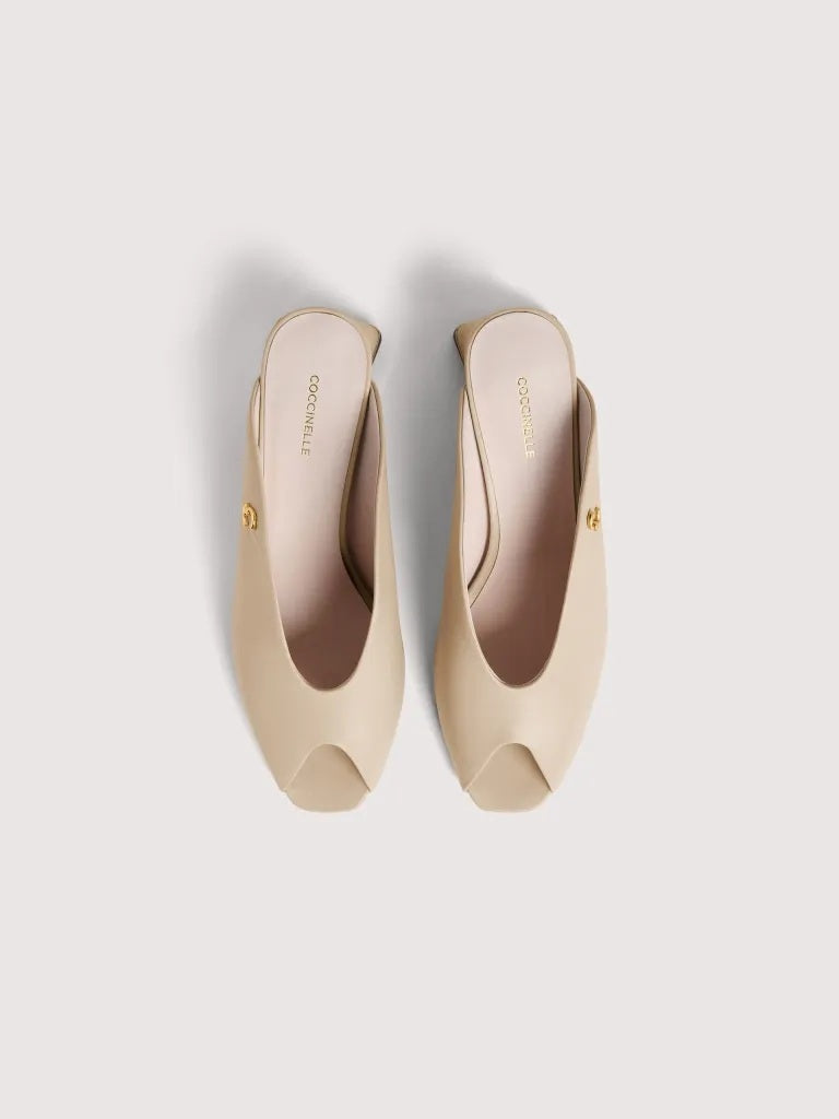 Coccinelle C-Everyday women's sandal with beige straps and low heel, stylish and comfortable footwear for everyday wear.