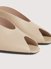 Coccinelle C-Everyday women's sandal with beige leather straps and ankle buckle, stylish and comfortable footwear.