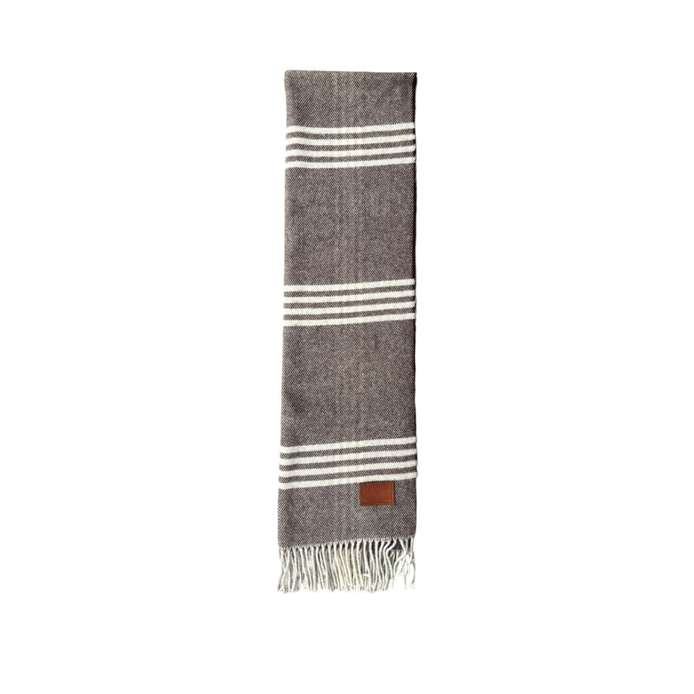 The Bridge men's scarf in a stylish patterned design, made of soft fabric, perfect for adding elegance to winter outfits.