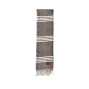 The Bridge men's scarf in a stylish patterned design, made of soft fabric, perfect for adding elegance to winter outfits.