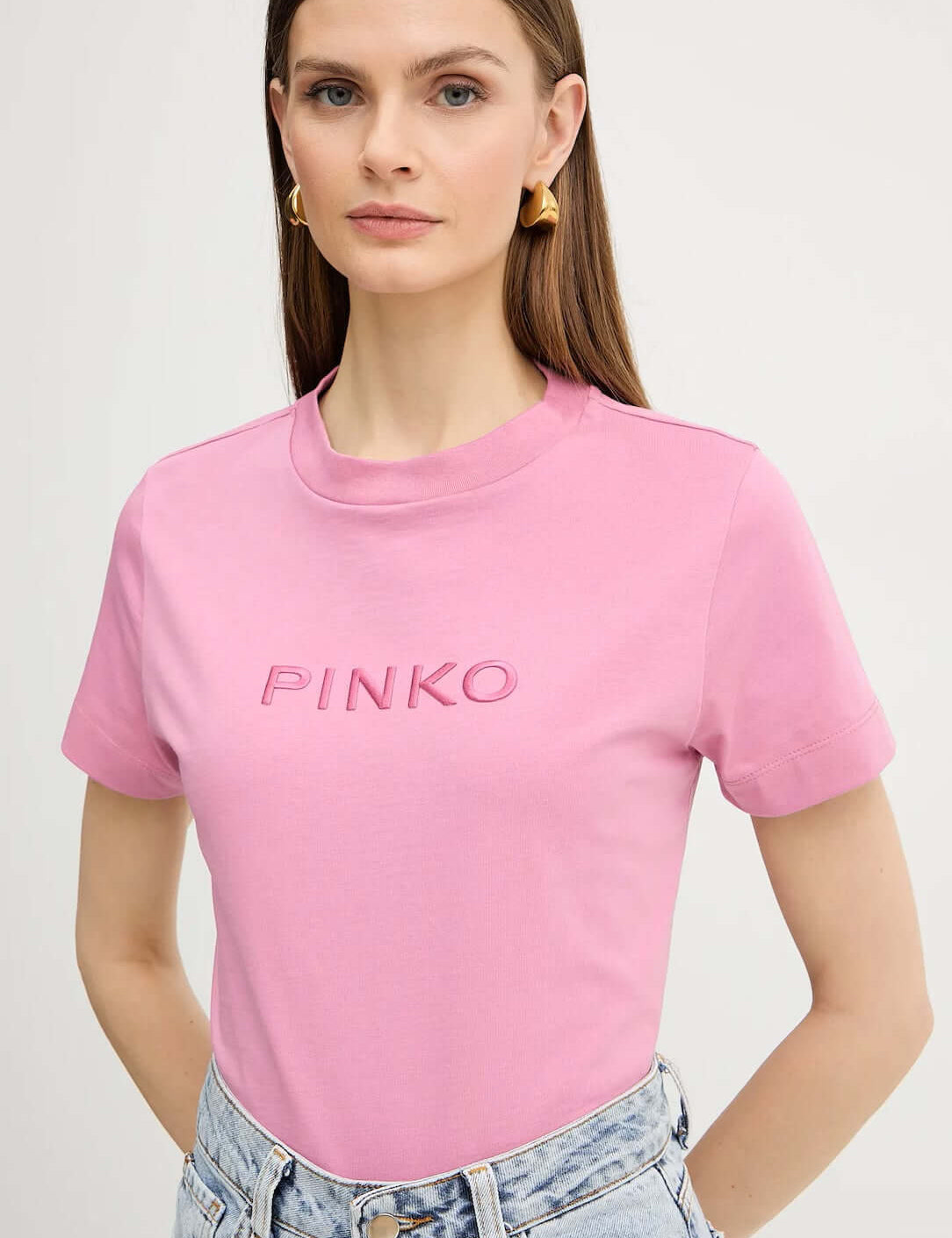 Pinko Donna T-shirt in pink with a casual fit, featuring a round neckline and short sleeves, displayed flat.