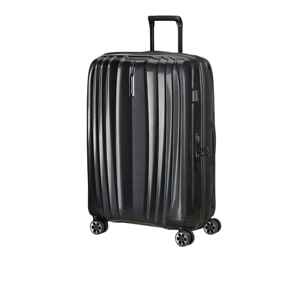 Large Samsonite Nexis Exp unisex trolley suitcase with four wheels and extended handle for travel, shown from a side angle.