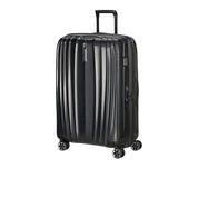 Large Samsonite Nexis Exp unisex trolley suitcase with four wheels and extended handle for travel, shown from a side angle.
