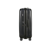 Large Samsonite Nexis Exp trolley with four wheels, durable hard shell, and extended handle for unisex travel and luggage.