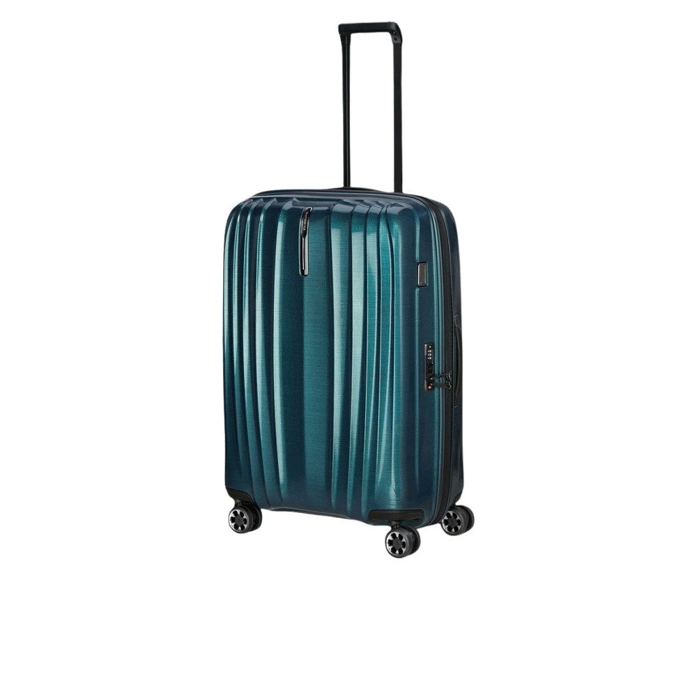 Large Samsonite Nexis Exp trolley with four wheels, sturdy handle, and durable navy blue exterior for unisex travel use.