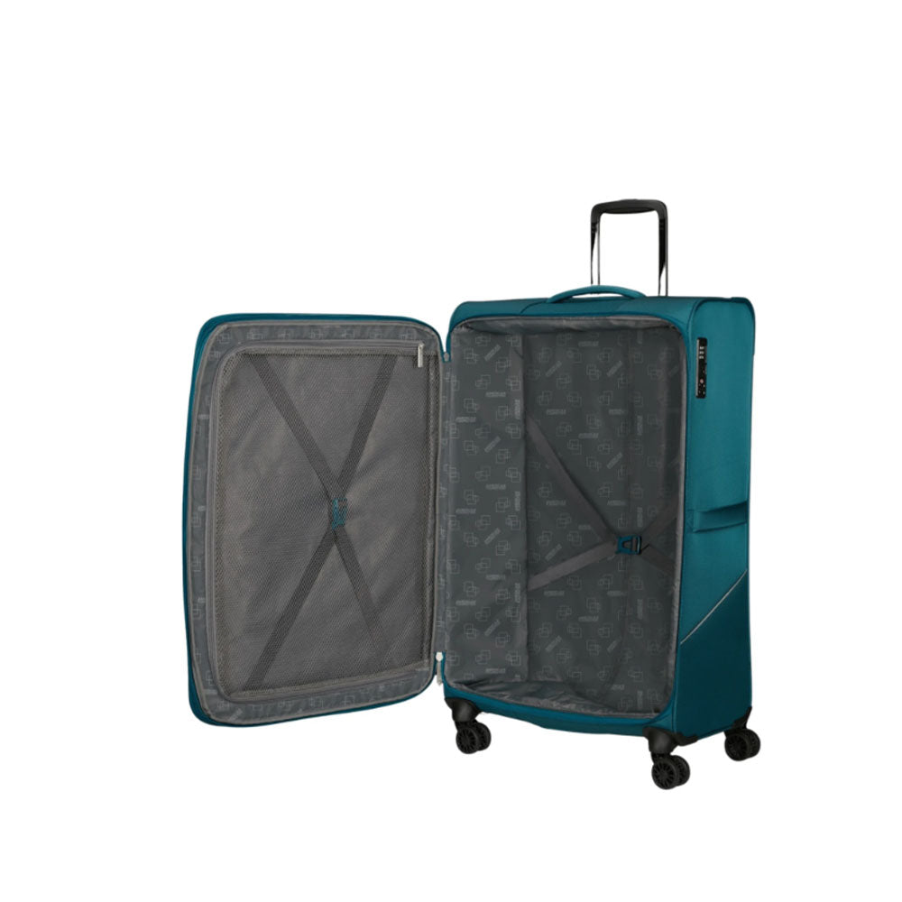 Unisex American Tourister Medio Summerride expandable spinner trolley for travel, with a sturdy design and multiple wheels.