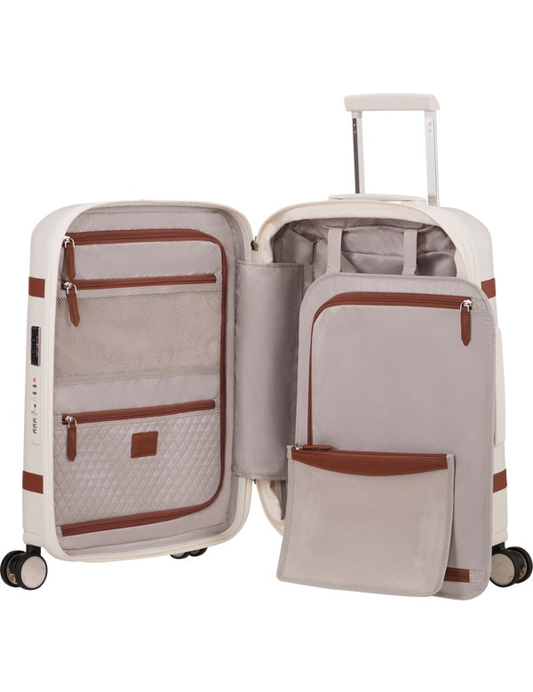 Unisex cabin trolley by Samsonite with durable hard shell, compact design, and four spinner wheels for easy travel.